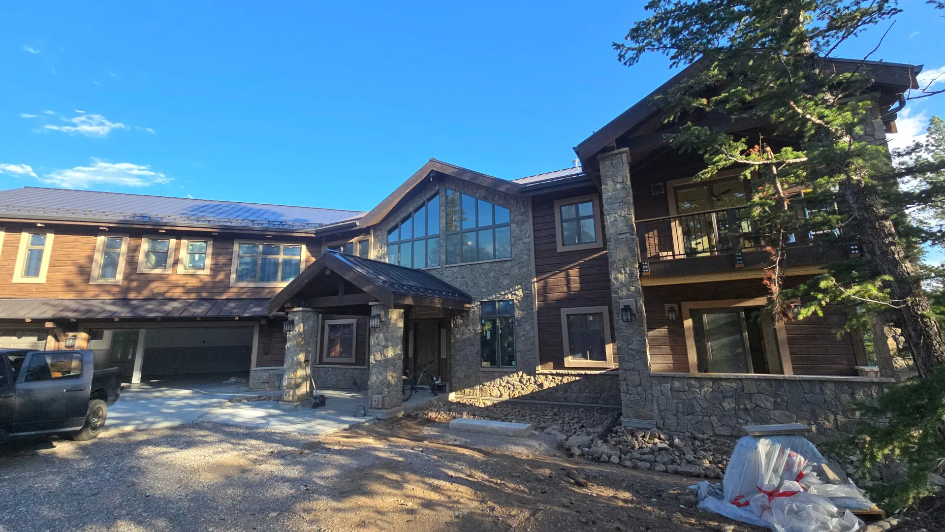 Mountain home with stone and wood siding near Golden, CO