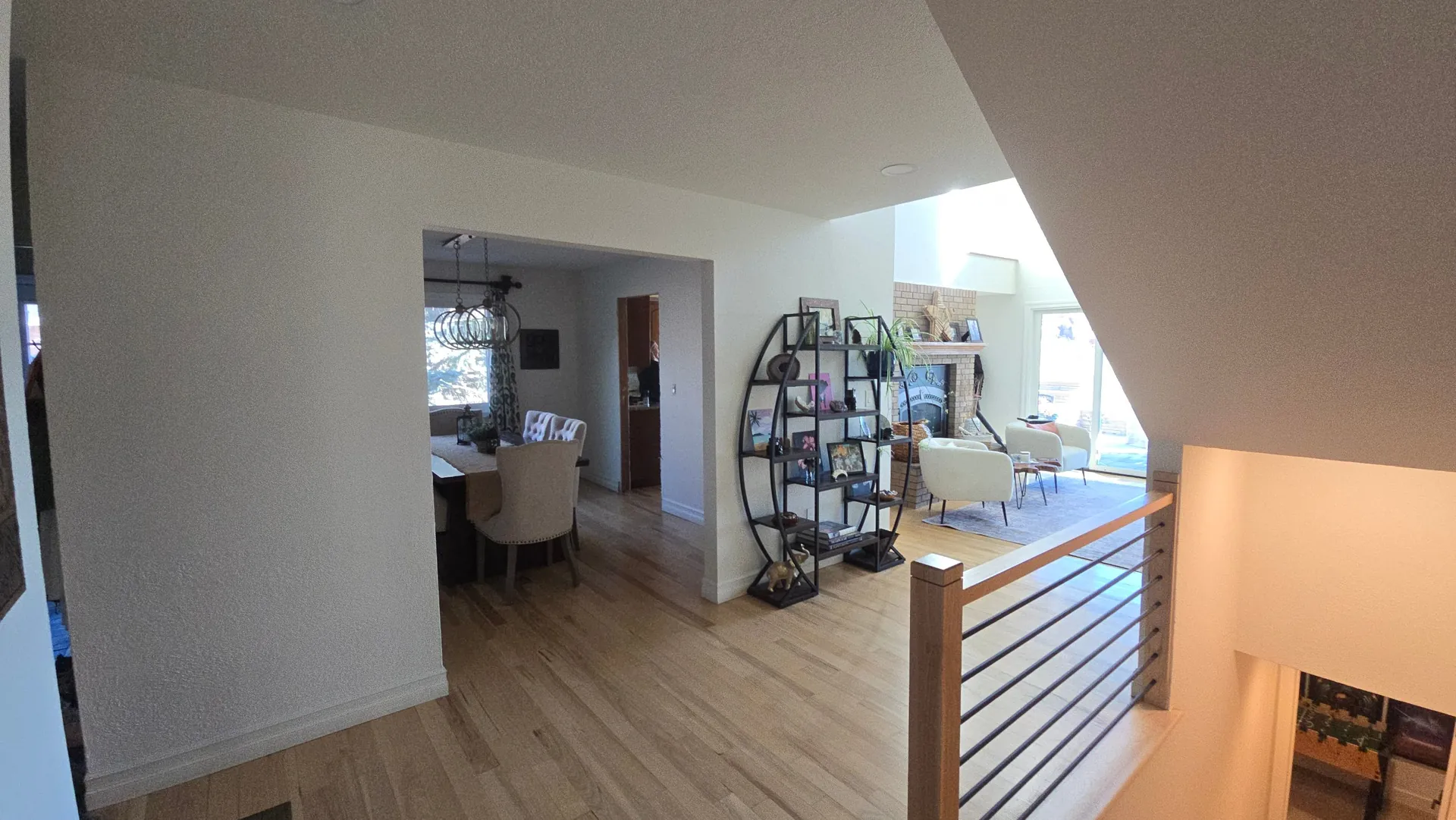 Open floor plan with new hardwood floors and cable stair railing in Golden, CO